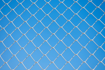 wire fence on blue sky background