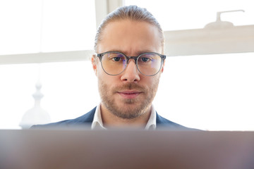 Serious concentrated young businessman