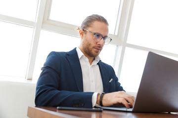 Serious concentrated young businessman