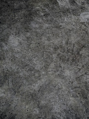 Fototapeta na wymiar Rough dark grey concrete wall background