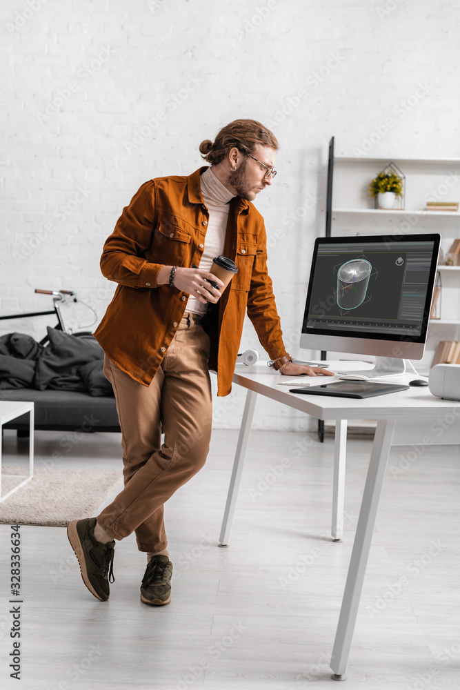 Poster digital designer holding coffee to go and looking at project of 3d design on computer monitor on tab
