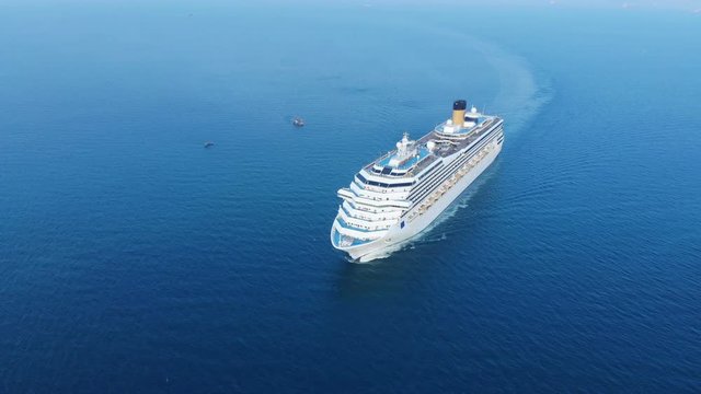 Aerial view of beautiful white cruise ship above luxury cruise in the ocean sea concept tourism travel on holiday take a vacation time on summer.