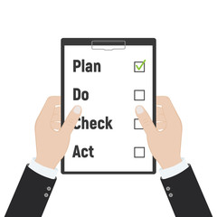 Plan Do Check Act. Businessman checks the action list holding clipboard in hand. Business concept. Action plan on paper. PDCA process.