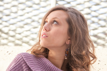 Portrait of an attractive young woman thinking