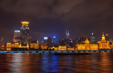 Fototapeta na wymiar Shanghai Bund reflected in Huangpu river in China 