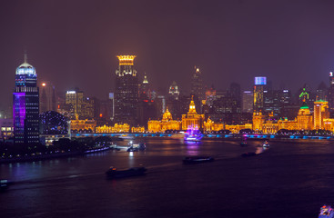 Shanghai boats sail along Huangpu by Bund in China 