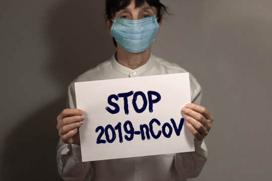 Coronavirus quarantine and Air pollution pm2.5 concept. Old sick woman wearing respirator mask for protect. Wuhan, China epidemic virus symptoms background, copy space.