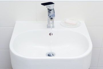 Modern bathroom sink in white home interior