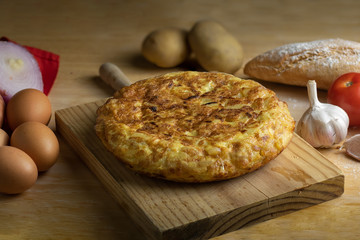 Homemade Spanish potato omelette accompanied with bread