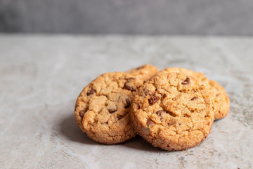 Freshly baked cookies placed on marbled texture