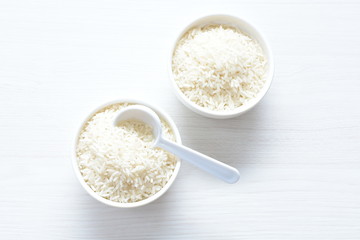 Natural raw white rice grains, on display in bowl