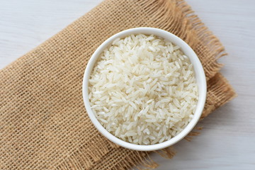 Natural raw white rice grains, on display in bowl