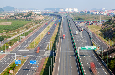 Shanghai road near Yangshan Port by Chinese hills 