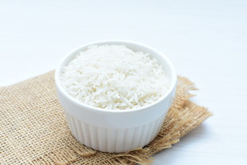 Natural raw white rice grains, on display in bowl