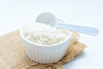 Natural raw white rice grains, on display in bowl