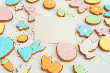 Easter card with gingerbread cookies. Easter card template. Egg shaped cookies and easter bunny. Happy easter holiday background concept. Copy space.