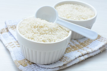 Natural raw white rice grains, on display in bowl