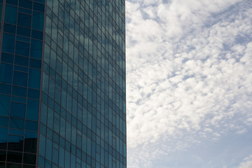 reflection of the sky in a glass building