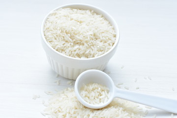 Natural raw white rice grains, on display in bowl