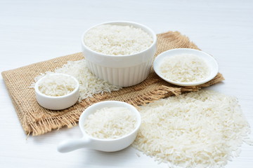 Natural raw white rice grains, on display in bowl