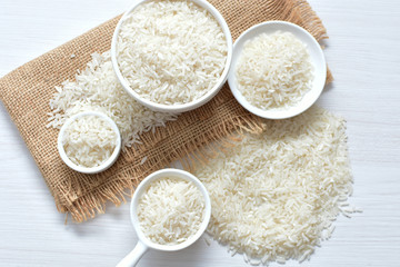Natural raw white rice grains, on display in bowl