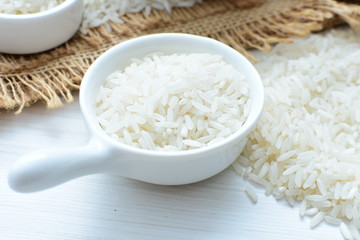 Natural raw white rice grains, on display in bowl