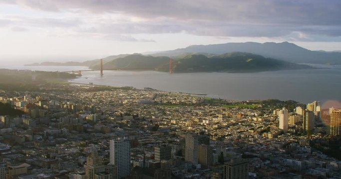 Aerial view of a residential neighborhood in San Francisco, California. United States. The Golden Gate Bridge in the background. Shot on Red weapon 8K.