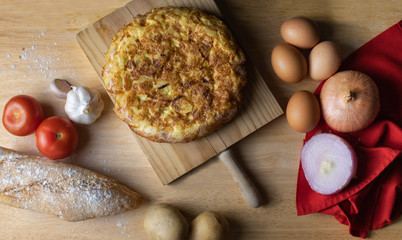 Homemade Spanish potato omelette accompanied with bread
