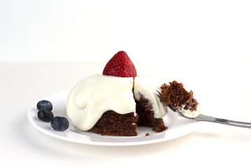 Ketogenic chocolate almond cake with whipped cream and strawberry. Low-Carb, Sugar-Free.