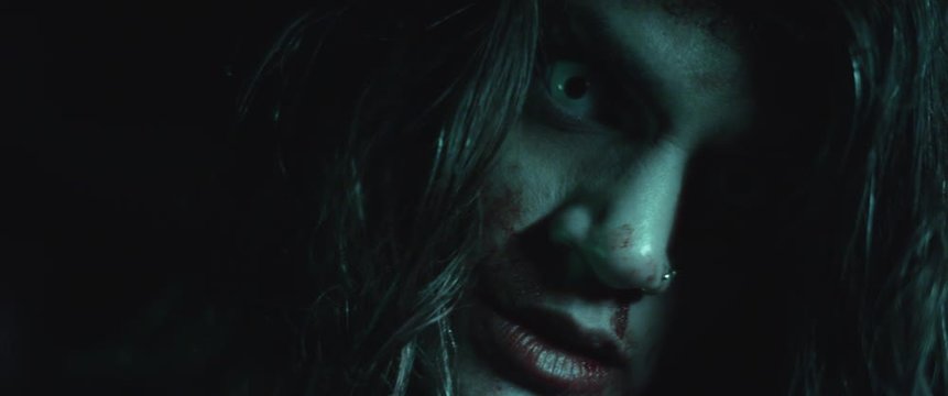 Terrifying creepy zombie woman with white eyes and bloody face. Scary look. Woman transformation into zombie concept. Horror style shot. Close up, slow motion, cinematic look. BMPCC 4K