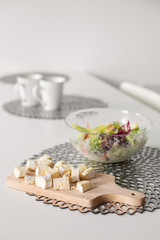 Healthy breakfast of fresh salad and cheese