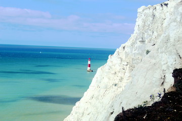 white cliffs with lighthouse