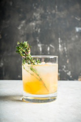 Old fahioned lemon beverage on the rustic background. Selective focus. Shallow depth of field.