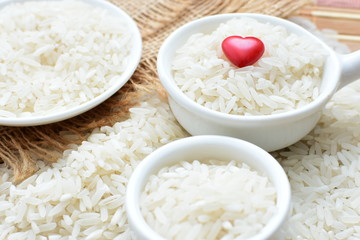 Natural raw white rice grains, on display in bowl