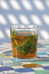 Africa - Morocco - Glass of mint tea. Famous hot drink with sugar in Arab countries 