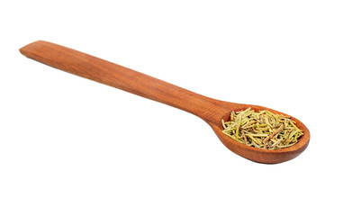 Dry rosemary in a spoon