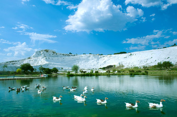 Carbonate travertines the natural pools during sunset, Pamukkale, Turkey