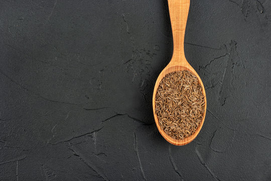 Dry cumin in spoon