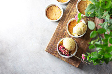 Crumble with cherry with vanilla ice cream.