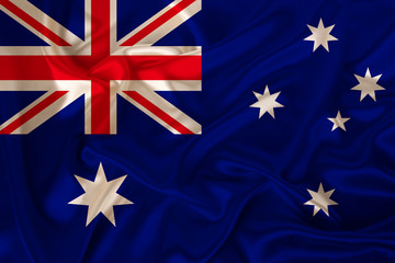 photograph of the national flag of Australia on a luxurious texture of satin, silk with waves, folds and highlights, closeup, copy space, travel concept, economy and state policy, illustration
