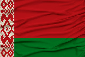 beautiful photo of a colored national flag of the modern state of Belarus on a textured fabric, concept of tourism, emigration, economy and politics, closeup