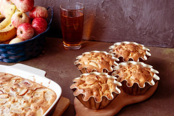 Cooking apple pie. Fruits -rustic apples on a platter on a dark background