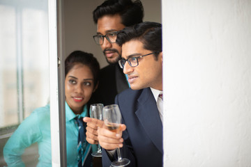 Corporate meetings between  young and energetic Indian Bengali bosses/officers/managers and secretary at balcony of the office building regarding buying a project land. Indian corporate lifestyle