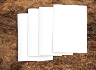 Blank portrait. white paper isolated on wood background. Poster mock-ups paper, identity design,...