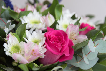 Pink roses and white chrysanthemums as background. Bouquet close-up. Postcard,