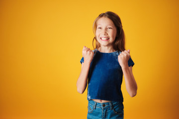 Little Redhead Girl Jumping For Joy And Happiness
