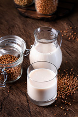 Vegan Buckwheat milk, closeup. Non dairy alternative milk. Healthy vegetarian food and drink concept. Copy space