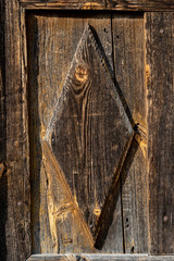 Texture od wooden planks. Door made of antique wood. Raw wood after century.