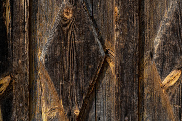 Texture od wooden planks. Door made of antique wood. Raw wood after century.