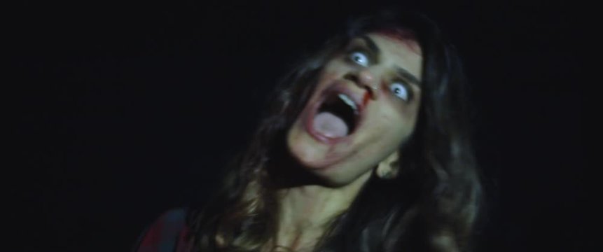 Zombie woman with white eyes screaming, looking scary and terrifying. BMPCC 4K